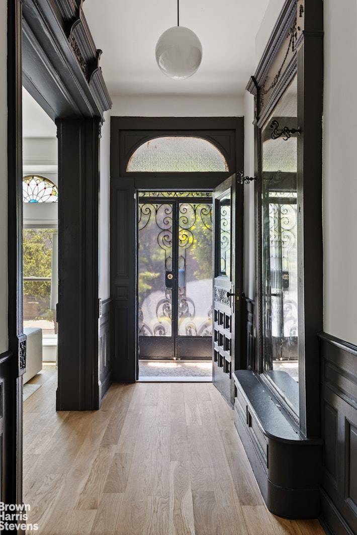 Soak up the sun and skyline views from your private rooftop deck, accessed via a fully retractable skydoor just one of the many standout features of this meticulously updated brownstone ...
