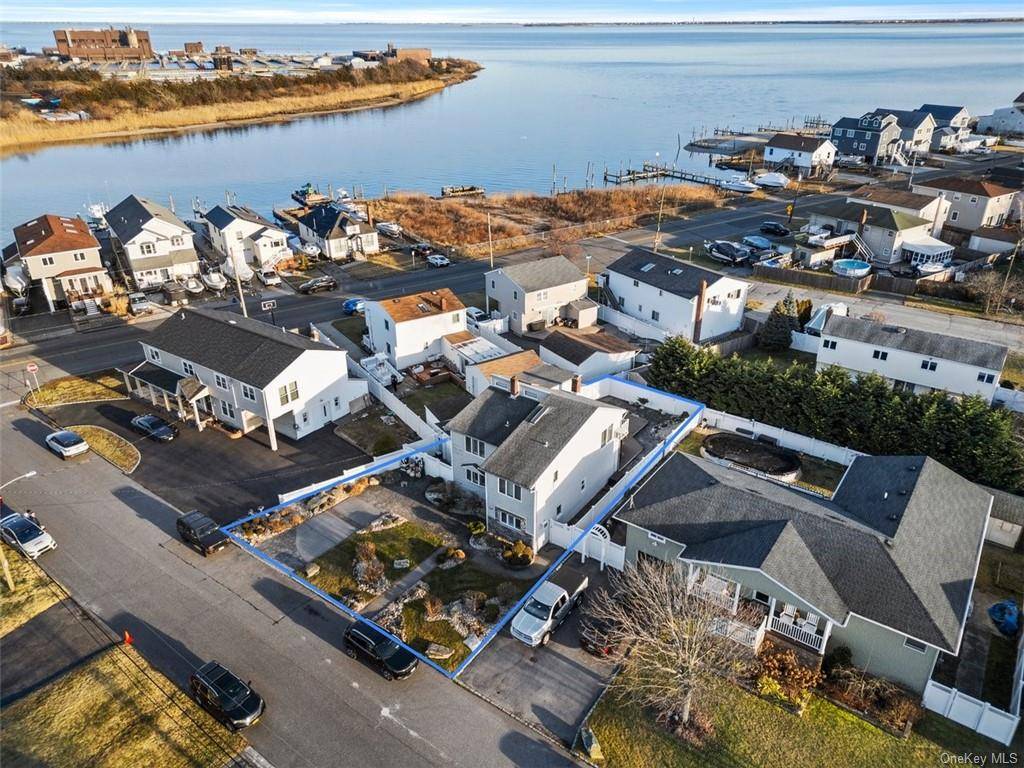 Dive into the coastal charm of this elegant 5 bd, 2 ba farmhouse style haven nestled just one block away from the tranquil waters, boasting private access to the Venetian ...