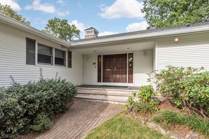 A large inviting front porch leads to 16 Manchester Drive, Westfield.