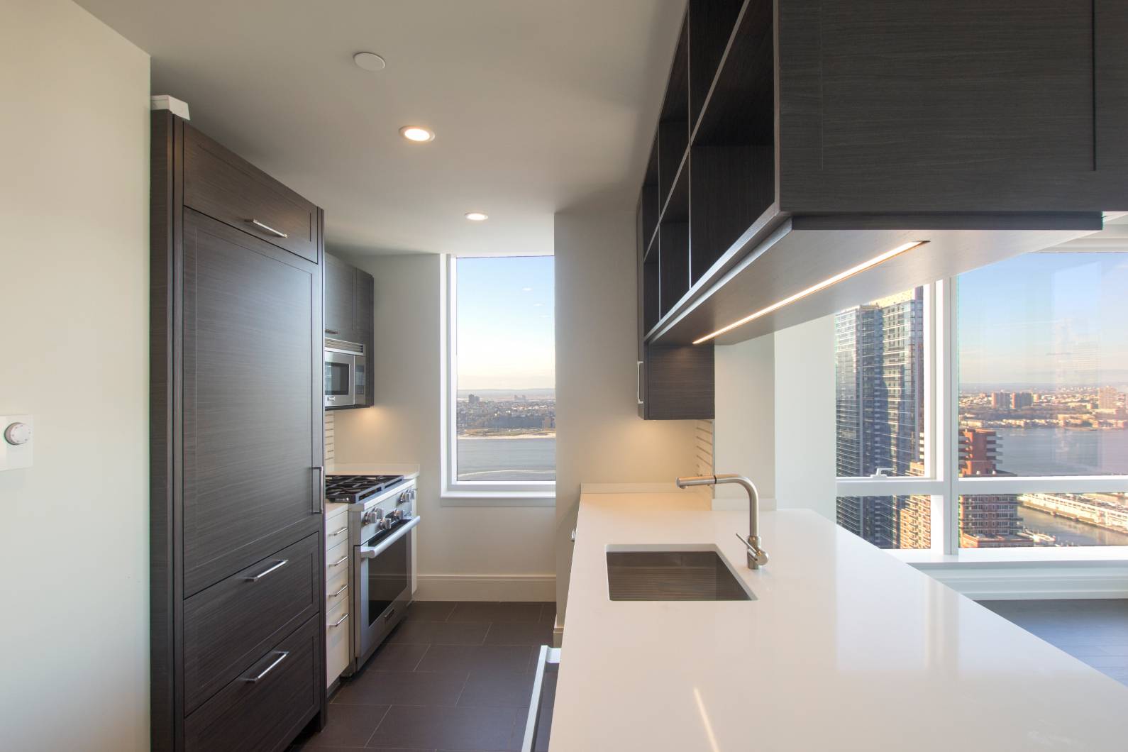 With sweeping views of the city from sunrise to sunset 555TEN towers over the new West Side.