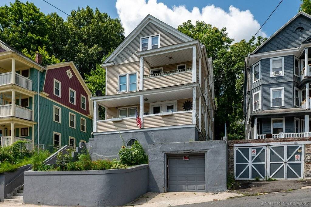 Investors Take Notice of this Income Producing Three Family Home in Waterbury that is Fully Rented.