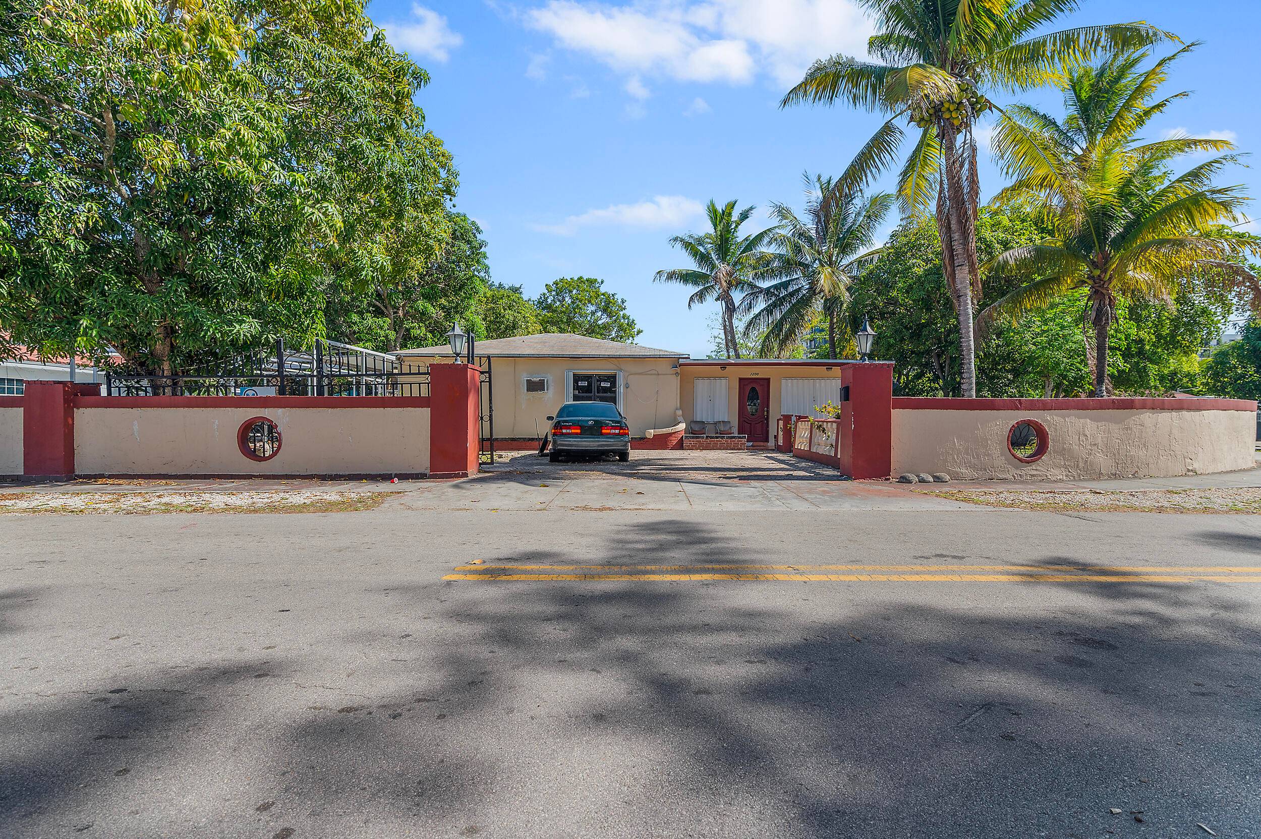Welcome to 1200 NE 128th St, a prime corner lot property located in the desirable Hampshire Heath subdivision of North Miami, FL.