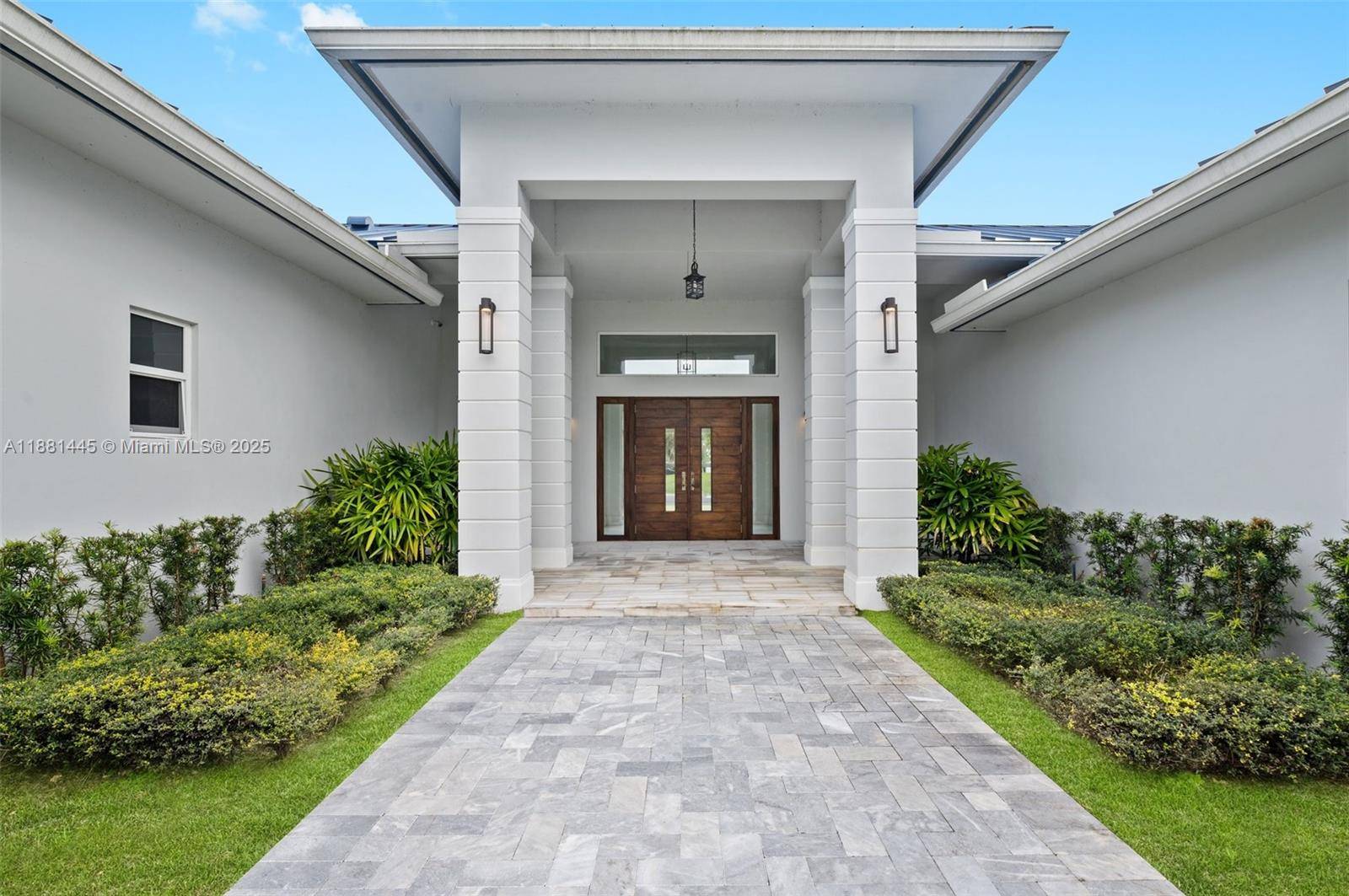 Exquisite 2021 custom built modern compound on 2 gated acres w private lake.