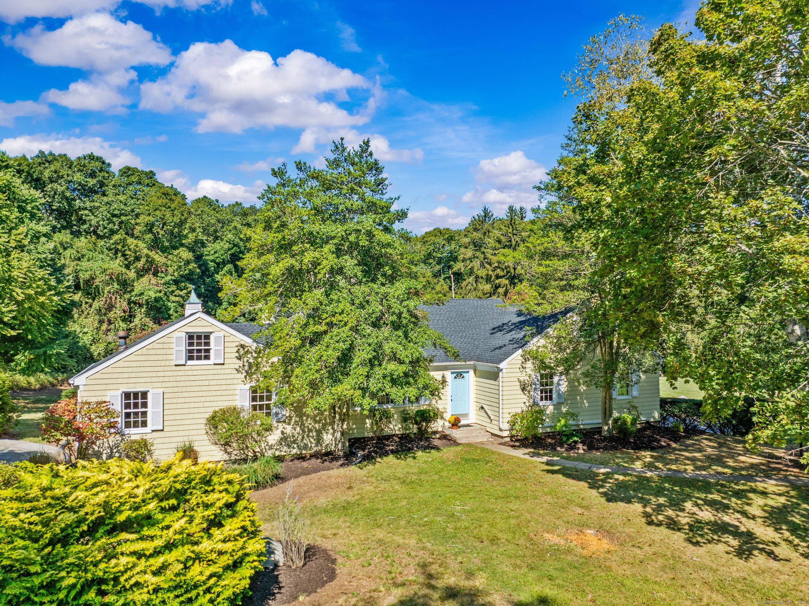 On a quiet cul de sac, sits this 2300 sf one floor custom home with an additional 300 sf three season sun room with propane stove in a lush, very ...