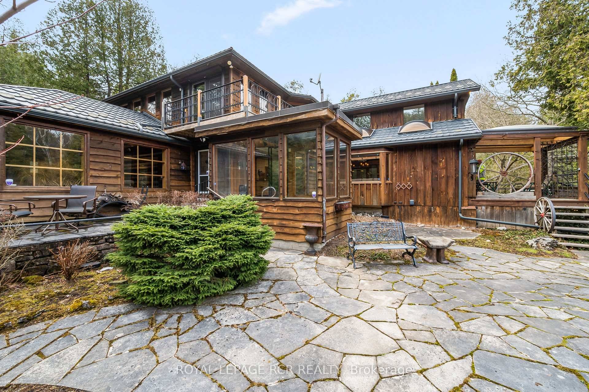 Tucked away on a secluded road, 15 River Bluff Path offers an extraordinary sanctuary blending natural beauty, creative energy, and quiet seclusion.
