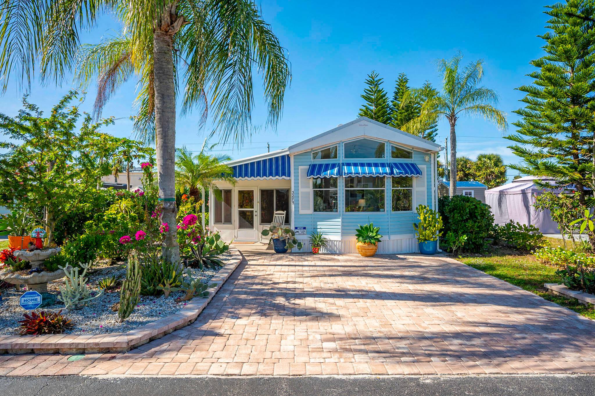 Welcome to this stunning tropical oasis beautiful home nestled in the tranquil and sought after Heritage Village community in Okeechobee, FL.