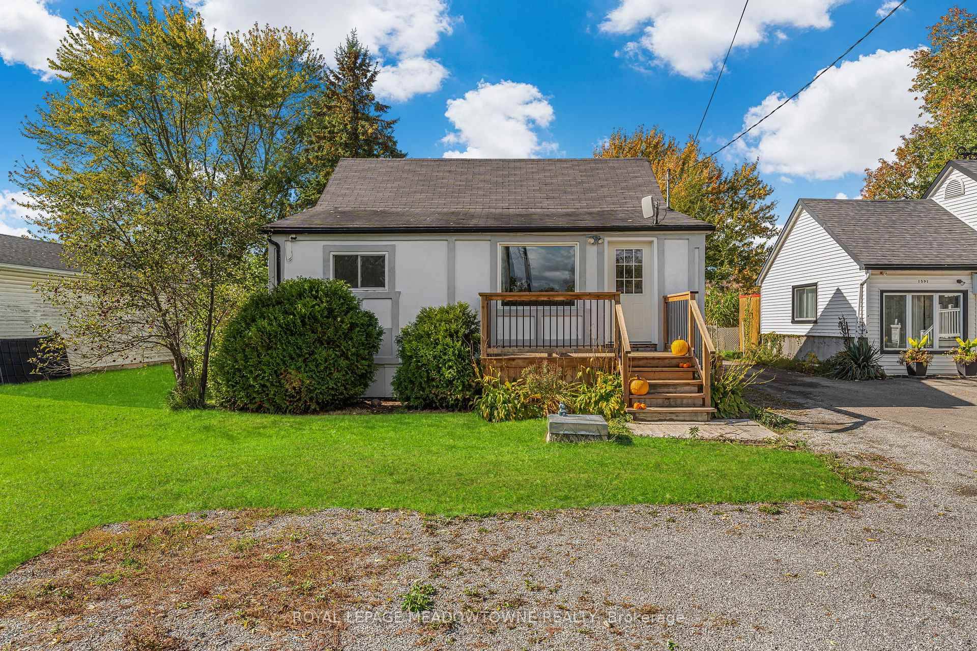 Welcome to 1583 Merrittville Hwy a charming 3 bedroom bungalow nestled on a picturesque, oversized lot surrounded by lush fields and open greenery.
