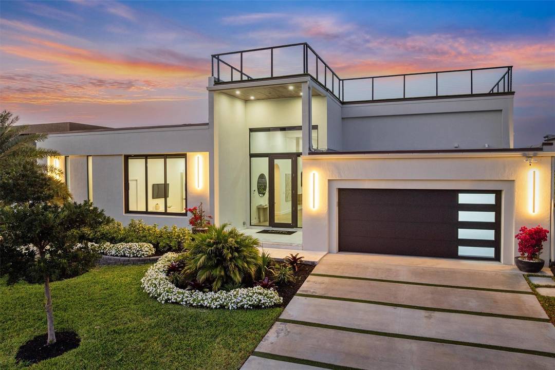 WELCOME HOME TO THIS SPECTACULAR MODERN RESIDENCE IN BAL HARBOUR, A GATED ENCLAVE OF OCEAN ACCESS WATERFRONT HOMES TUCKED AWAY IN A QUIET STRETCH OF THE MIDDLE RIVER !
