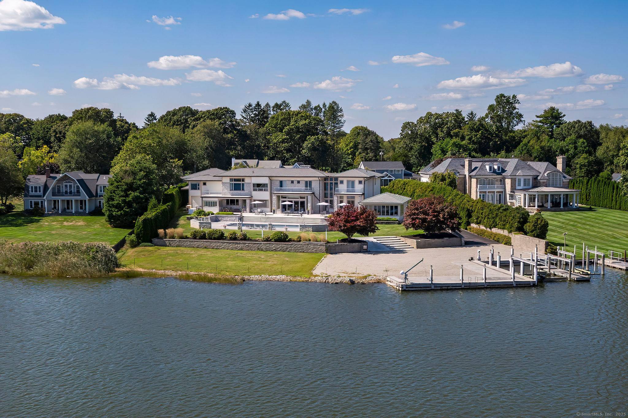 An EXTRAORDINARY MODERN MASTERPIECE Inspired by renowned architect Frank Lloyd Wright, sited to take full advantage of an exceptional, private 1.