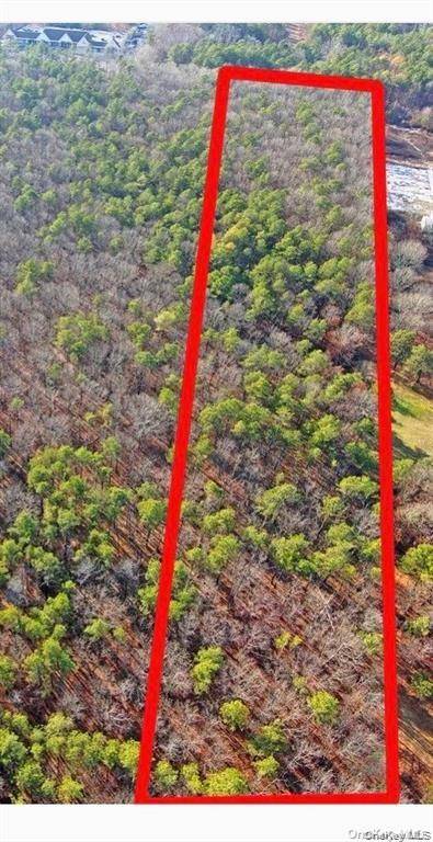 5 Acre lot located down dirt road wooded and level.