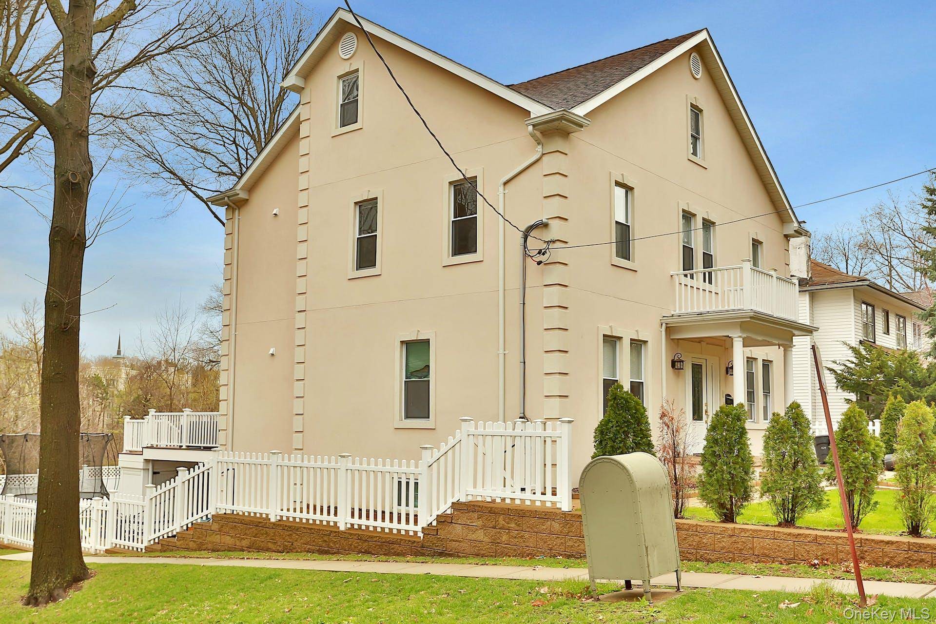 Stucco 4 BR, 2. 5 Bath Center Hall Colonial located in the Armour Villa Cedar Knolls section.