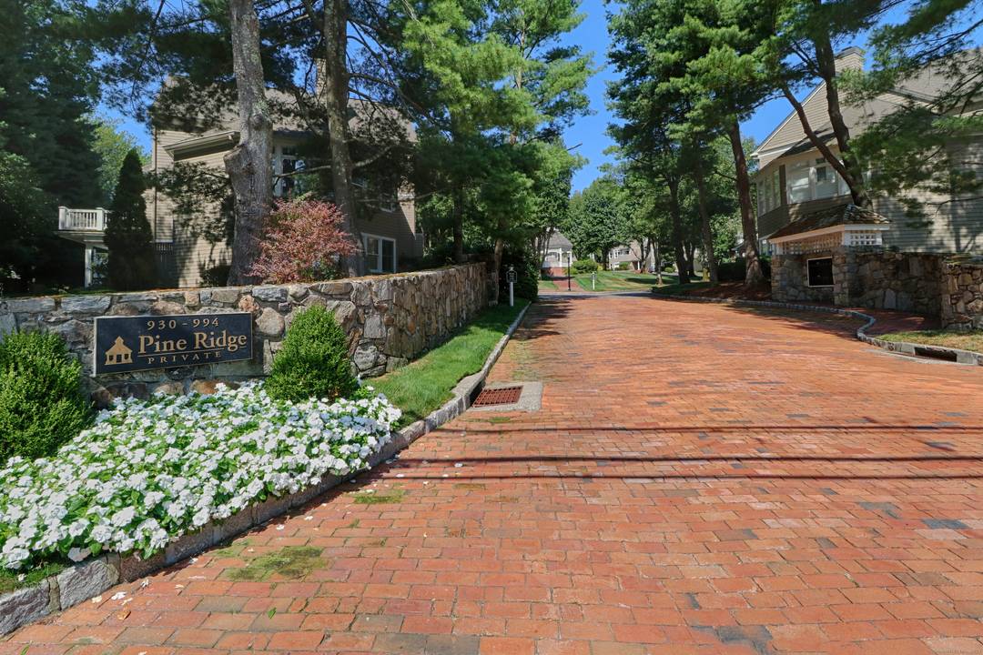 Nestled in a serene, beautifully landscaped community, this gracious townhouse at Pine Ridge offers the perfect blend of privacy and lifestyle.