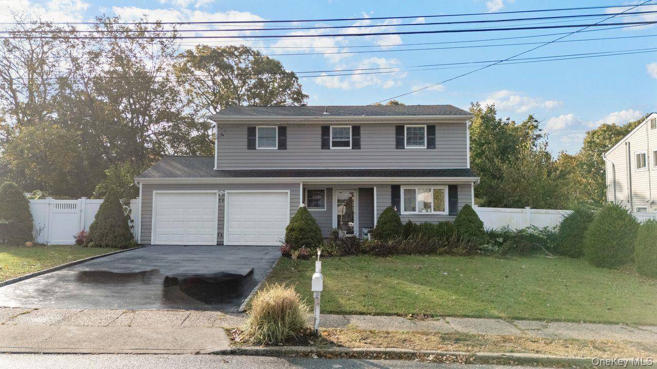 Welcome to this beautifully maintained 4 bed, 2 bath home nestled in a peaceful Selden neighborhood.