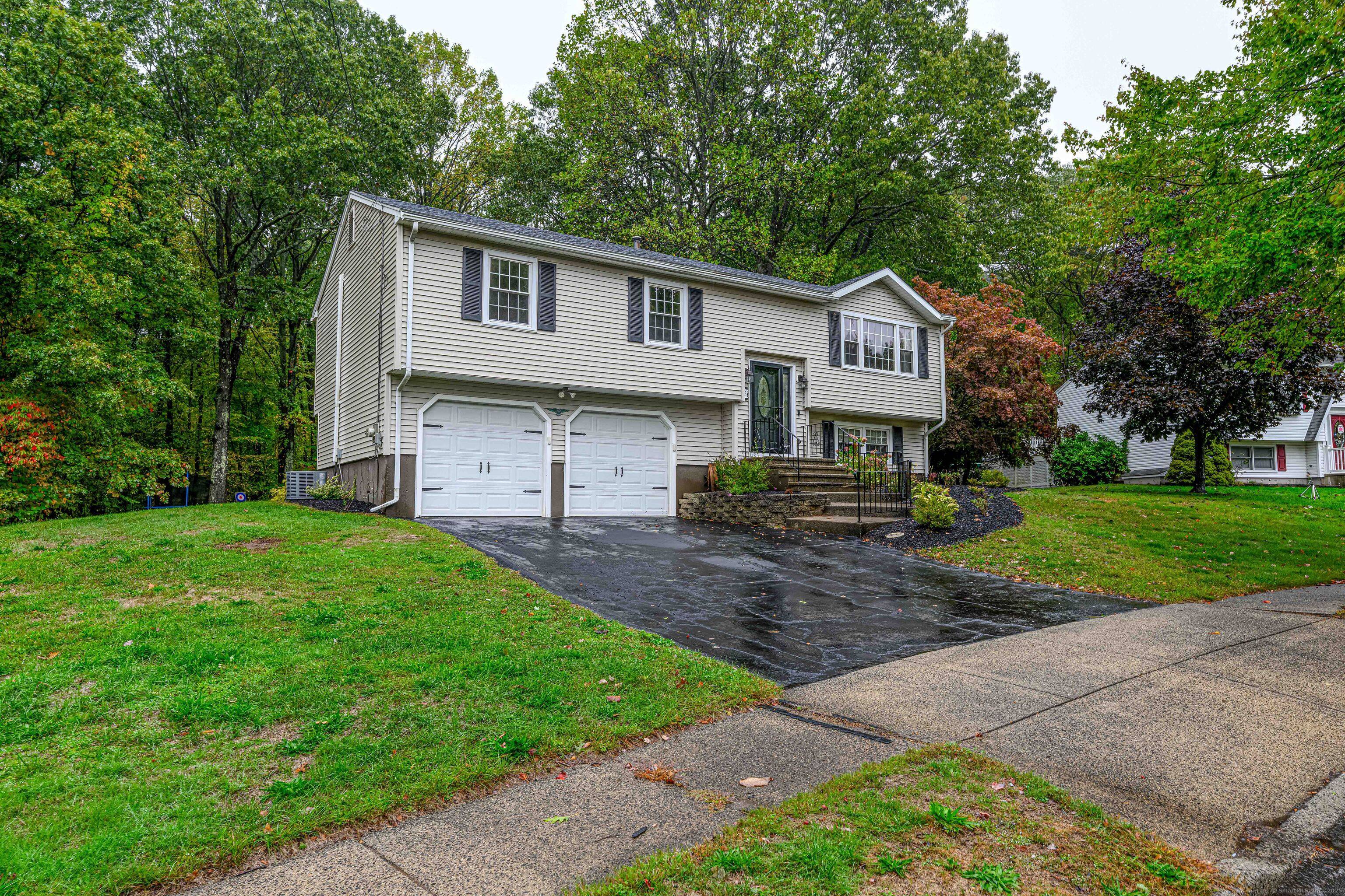 Welcome to this beautifully updated 3 bedroom, 3 full bath Raised Ranch in East Haven, CT.