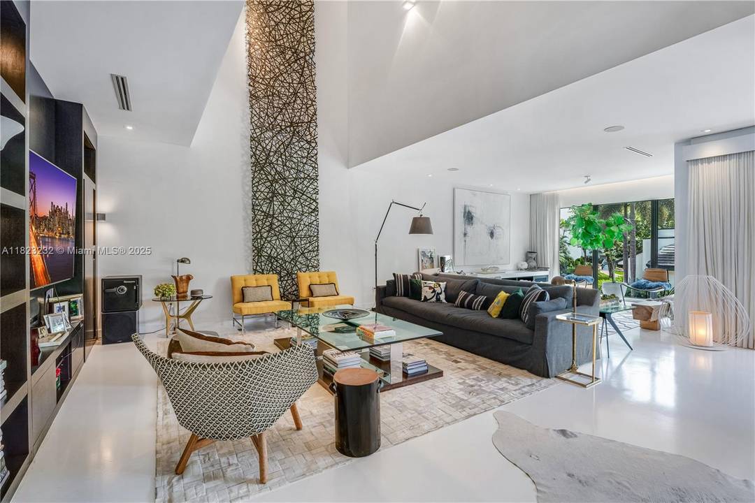 Experience private, gated resort style living featuring a private BOAT SLIP and two clay tennis courts.