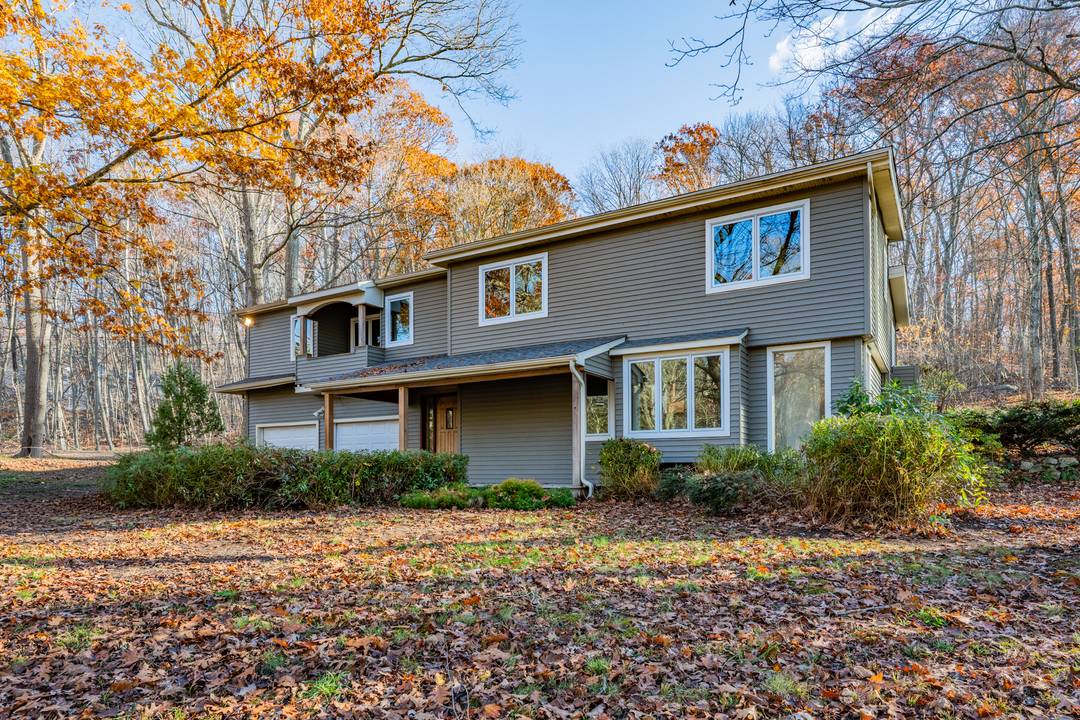 Situated on over 2 acres of private, wooded, park like grounds, this spacious Split Level home is ready to move in and put your touches on it and make it ...
