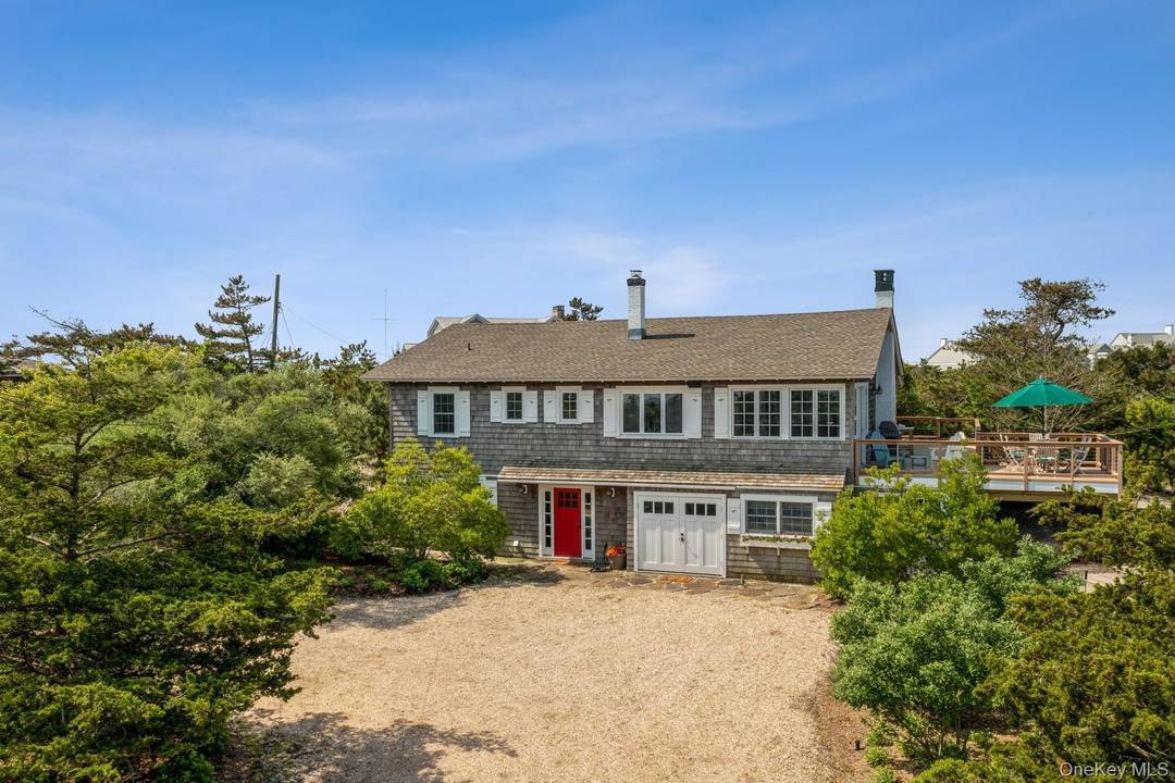 Welcome to 196 Dune Rd., a designer renovated, immaculate beach house with a private path to the ocean and magnificent bay views.