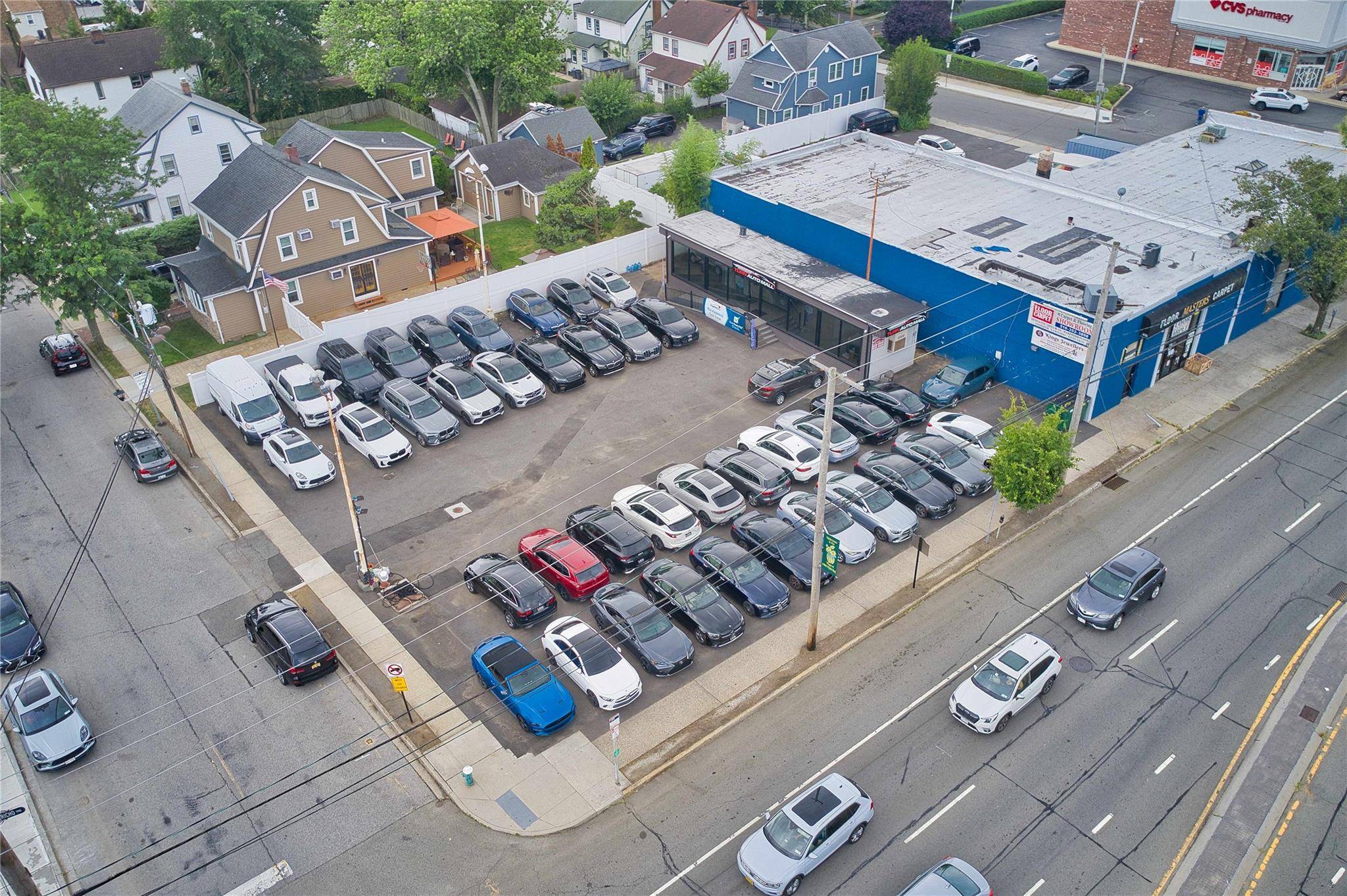 Rare opportunity to own a highly visible corner car lot in the heart of New Hyde Park.