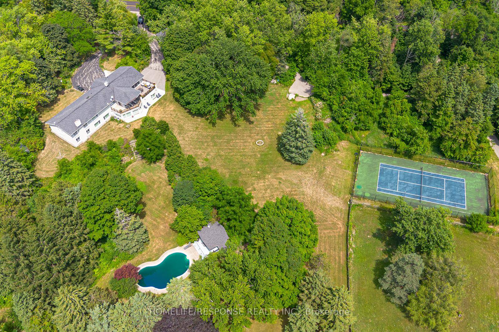 Welcome to this stunning executive bungalow, beautifully nestled atop just over 25 acres of rolling, scenic land in sought after Caledon.