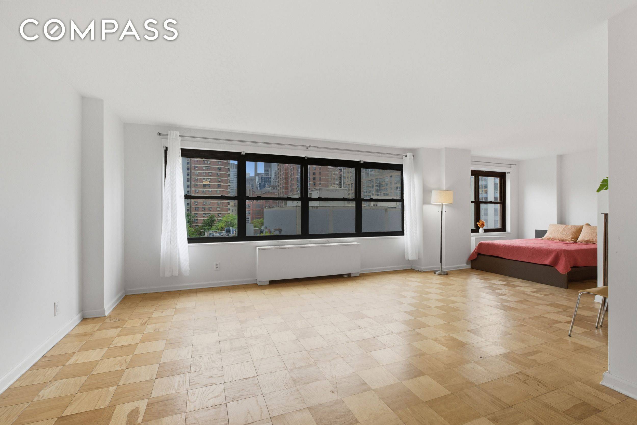 JUMBO SOUTH FACING STUDIO WITH TONS OF LIGHT AND AIR !