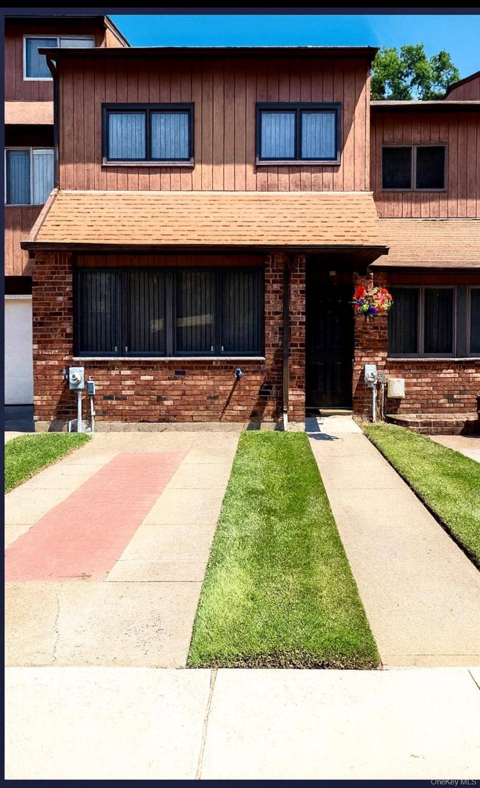 Step into this stunning townhome nestled in the highly sought after Stonegate Drive community.