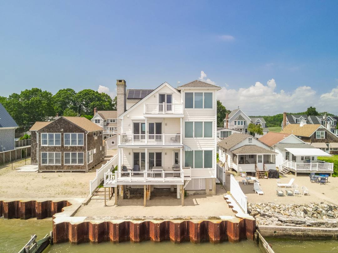 Experience year round coastal living at its finest in this meticulously maintained 4 bedroom, 4 bathroom waterfront retreat, offering 4, 381 square feet and three floors of open, airy elegance ...