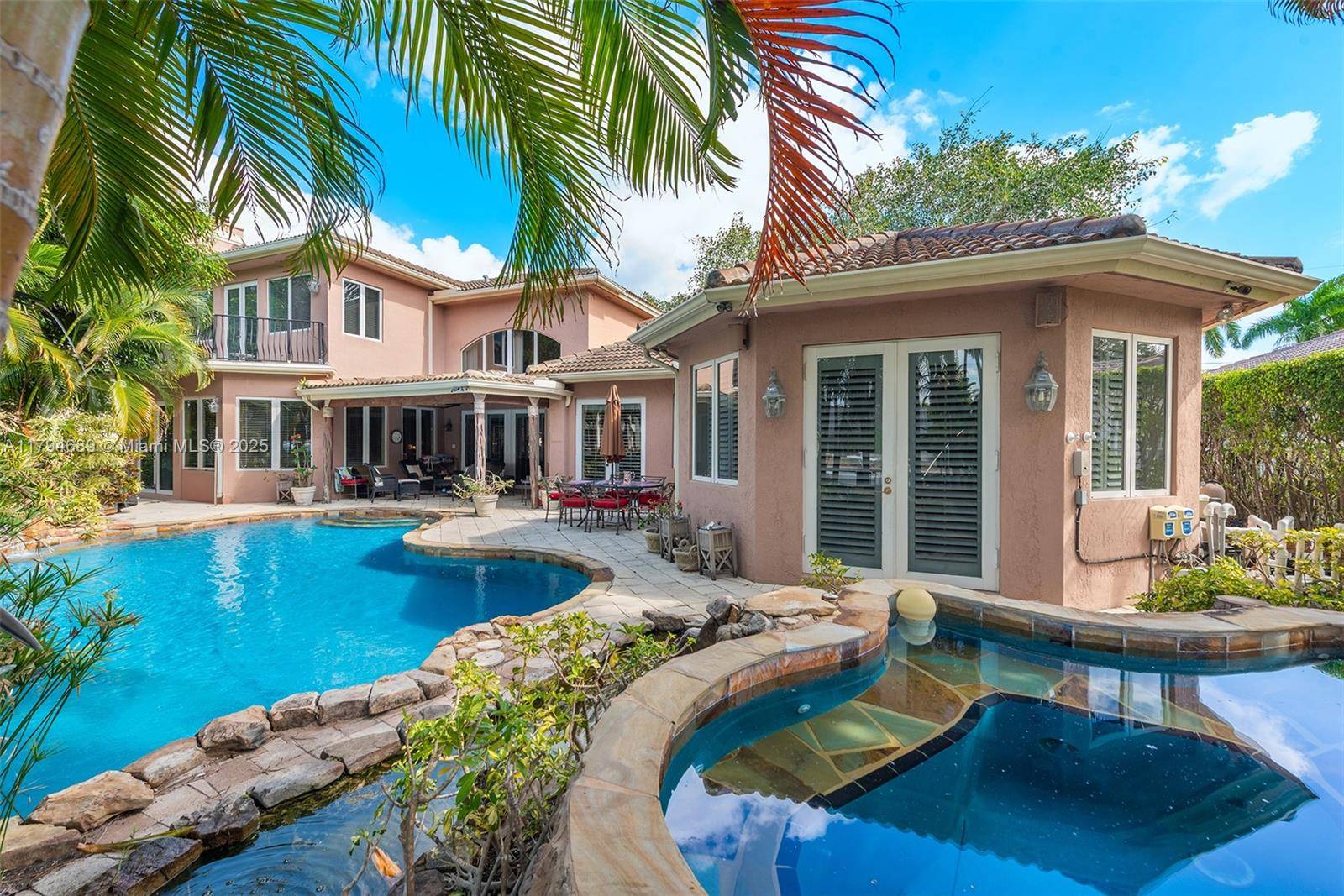 Exceptional waterfront estate in the prestigious Coral Ridge community offering 100 ft of deep canal frontage with private dock able to accommodate a large vessel.