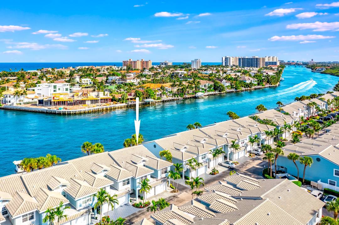 Welcome to your waterfront oasis in the highly sought after gated community of Boca Quay !