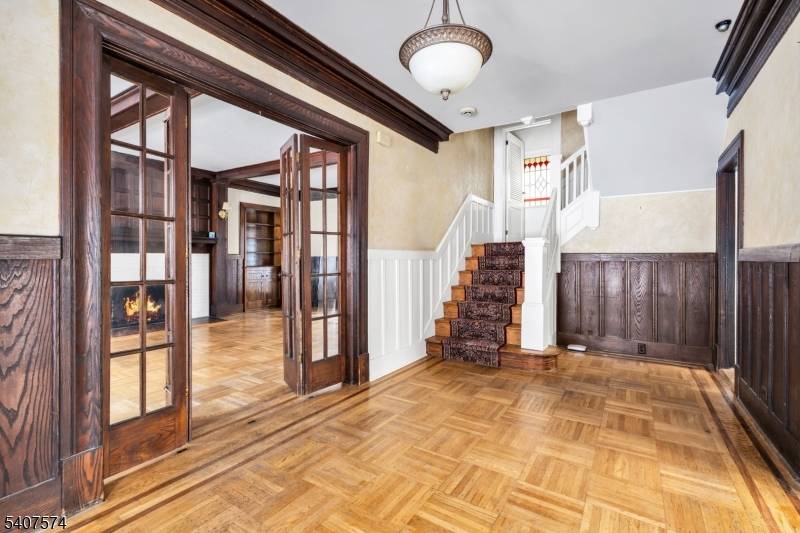 Set within the desirable Mountain Lakes enclave, this distinguished 1913 Hapgood Craftsman is a rare offering that seamlessly blends architectural heritage with refined living.