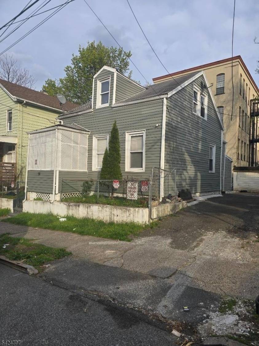 COME AND CHECK OUT THIS BEAUTIFUL TWO FAMILY HOME.
