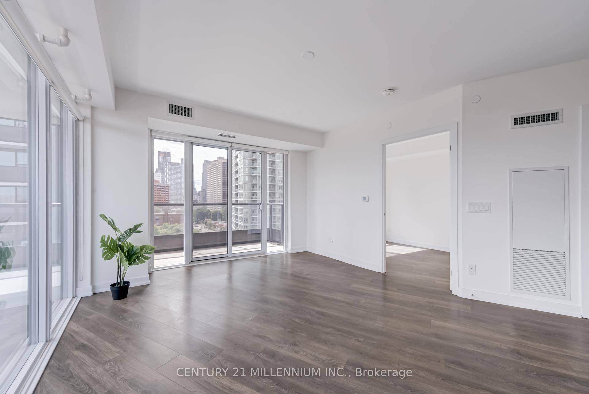 Spacious south and west facing downtown condo corner unit with 3 bedrooms, 2 bathrooms, and a large wrap around balcony.