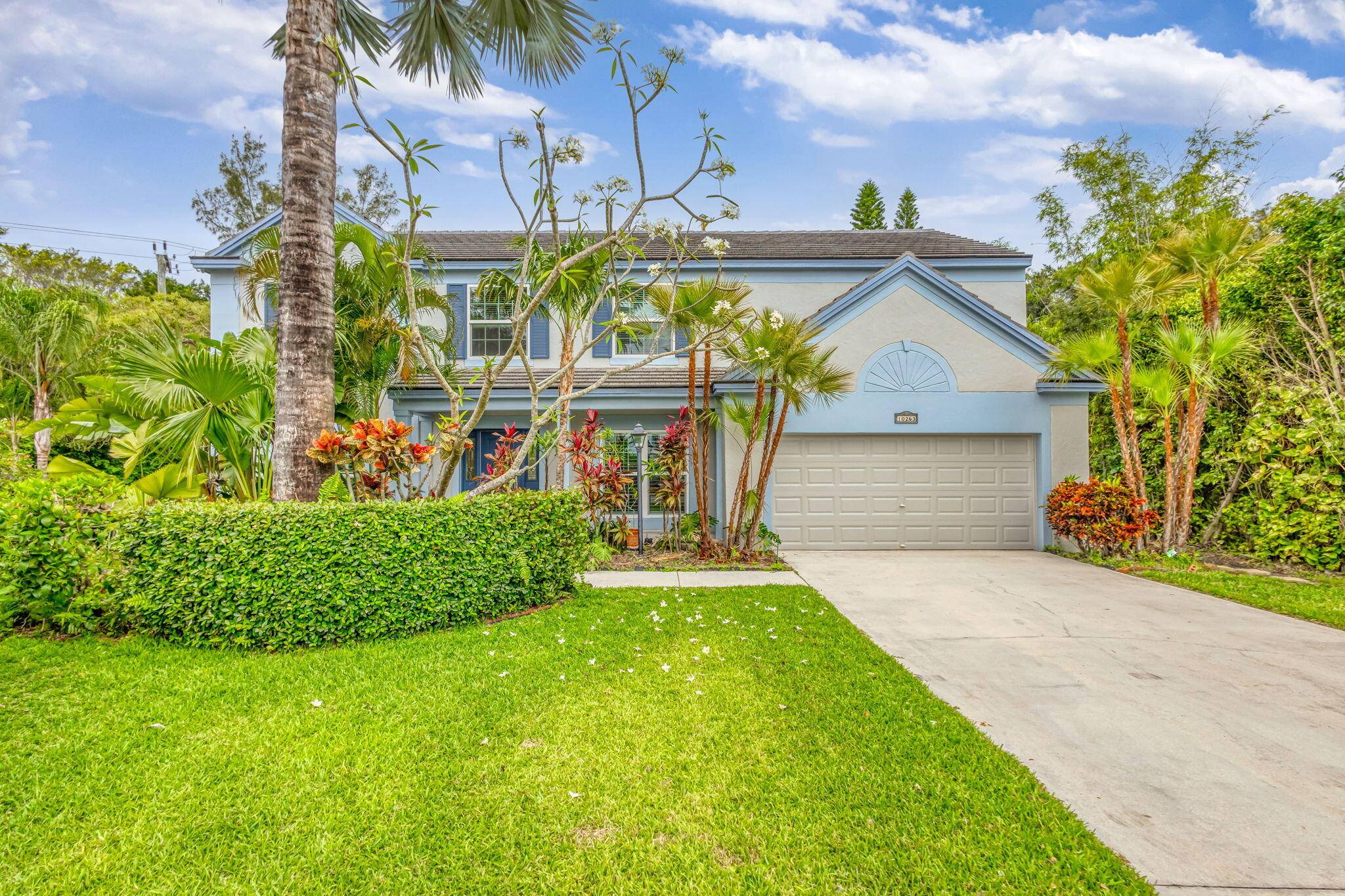 Located in highly desirable gated family community in heart of PBG, this beautiful 4 3 2 story home sits on triangular lot with oversized backyard and pool, formal DR, LR, ...