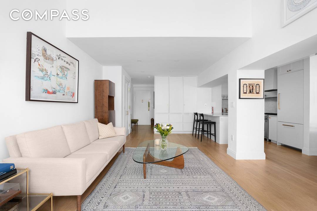 Introducing a rare opportunity to own a remarkable two bedroom, two bathroom duplex home with a home office den and two living spaces at 77 Bleecker Street, Unit 123E.