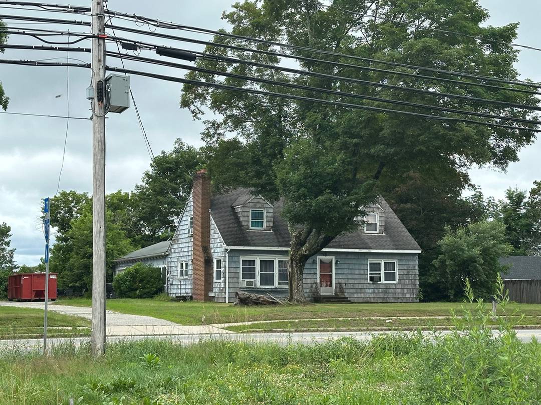 This strategically located property offers a prime commercial redevelopment opportunity with substantial road frontage directly adjacent to a busy traffic light, providing excellent visibility and exposure to steady vehicle flow.