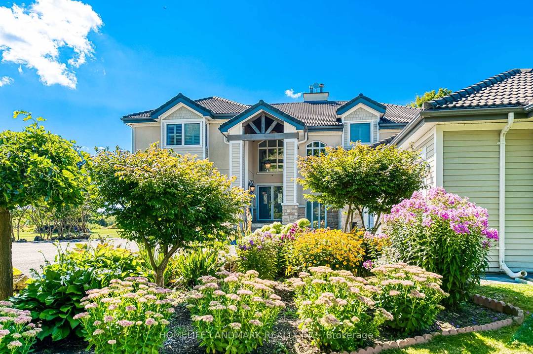 A Romantic Tree Lined Winding Driveway Leads To This Sensational Estate Known As Queensville Estate Situated on 10 Acre Picturesque Land.