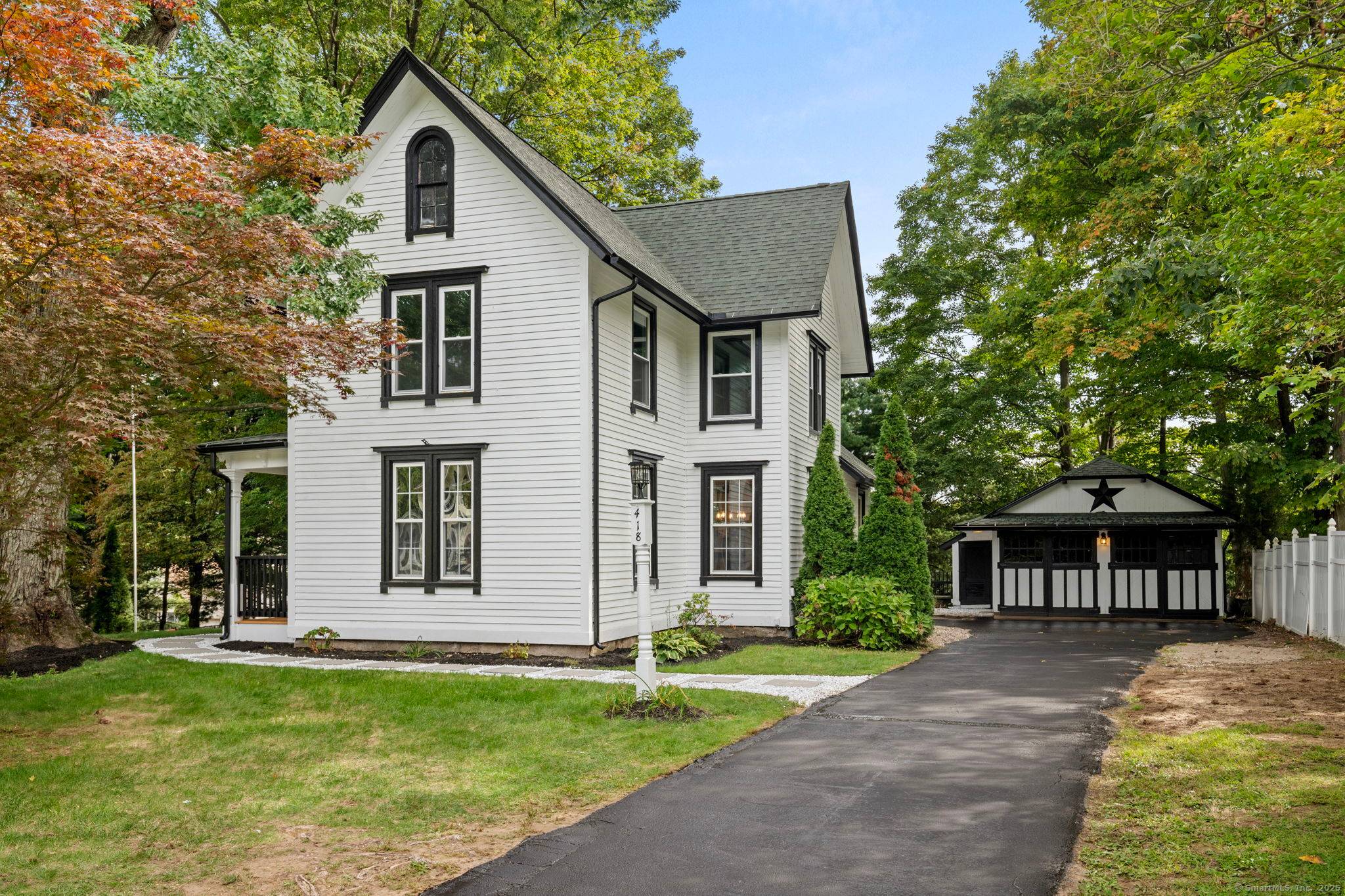 Welcome to 418 Washington Street, a beautifully remodeled New England Colonial that blends timeless charm with modern comfort.
