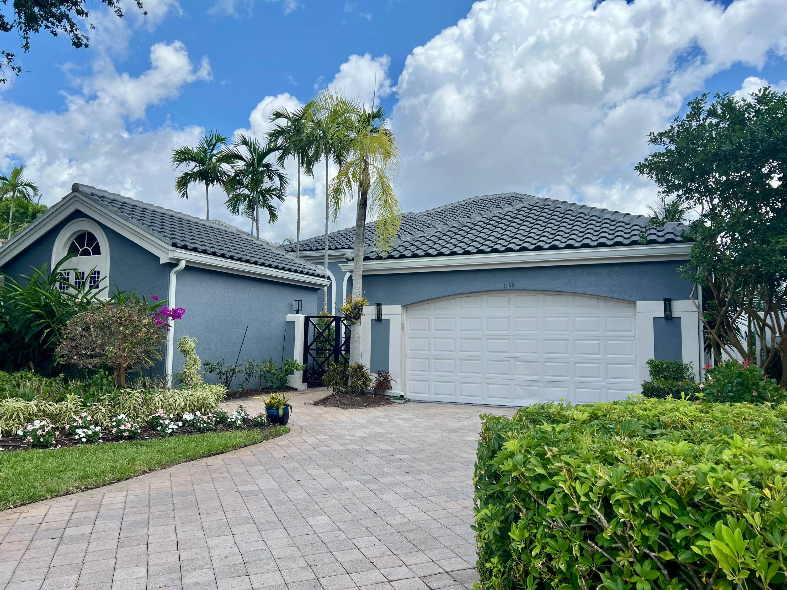 Experience luxury living at its finest in this stunning 4BD 4BA, 3, 365 SF seasonal rental located in the prestigious Ballenisles Country Club community.