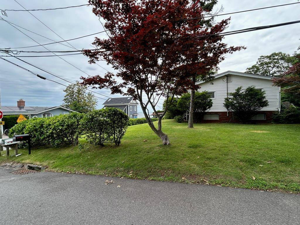 Water view. Enjoy living in this open floor plan spacious 3 bedroom potentially 4 bedroom, 3 bathroom home located in a private beach community in Sound Beach.