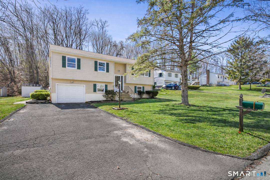 Welcome Home ! This charming raised ranch is located in a desirable Danbury neighborhood known for its walkability and convenient location near Candlewood Lake, local parks, shopping, and commuter routes.