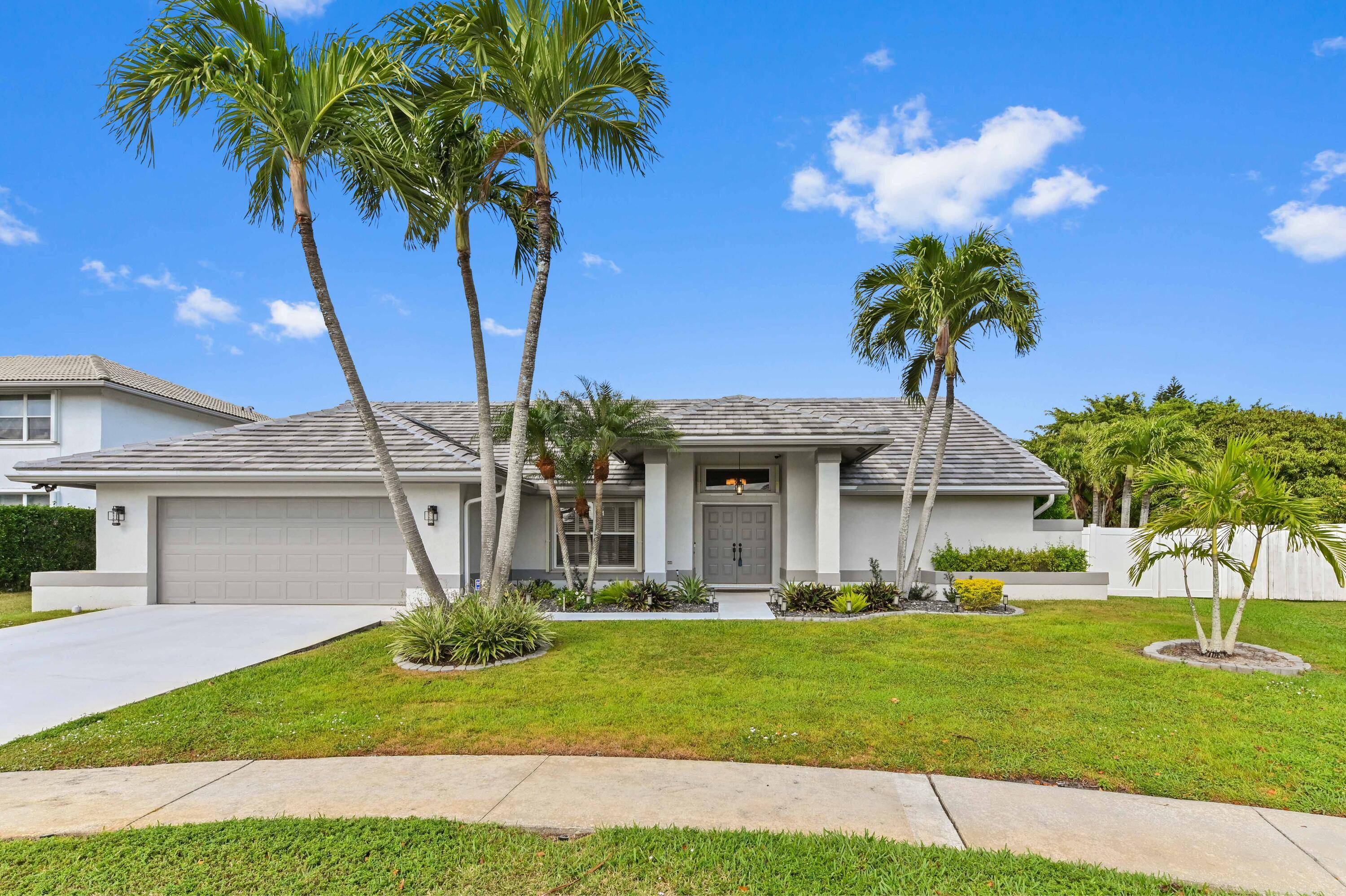 Welcome to this beautifully updated 5 bedroom, 3 bathroom pool home in the sought after gated community of Lakeview Estates in Lake Worth.