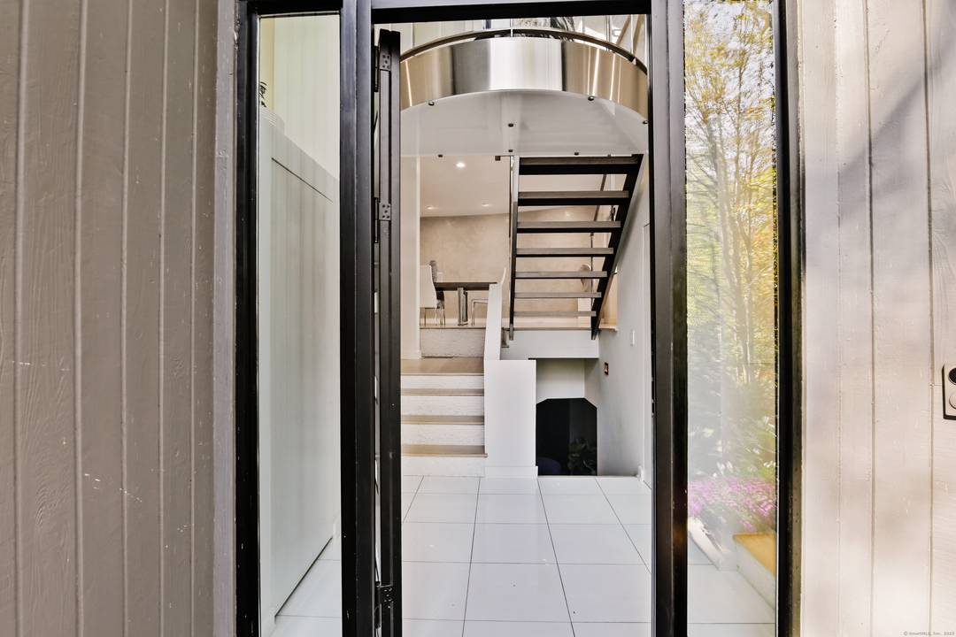 Welcome to 210 Red Fox Road, a stunning hilltop sanctuary nestled on a quiet cul de sac in Stamford, CT.