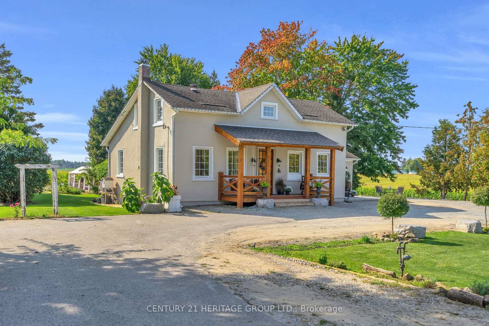 Escape the city and discover this beautifully renovated 4 bedroom farmhouse on a private lot surrounded by rolling farmland and mature trees.