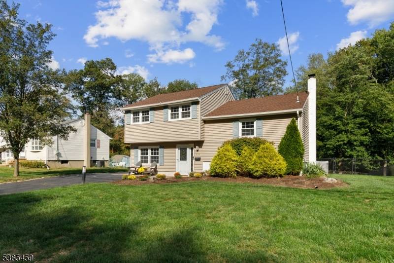 Updated 4 bedroom, 2 full bath split level residence resides in a tranquil, tree lined neighborhood.