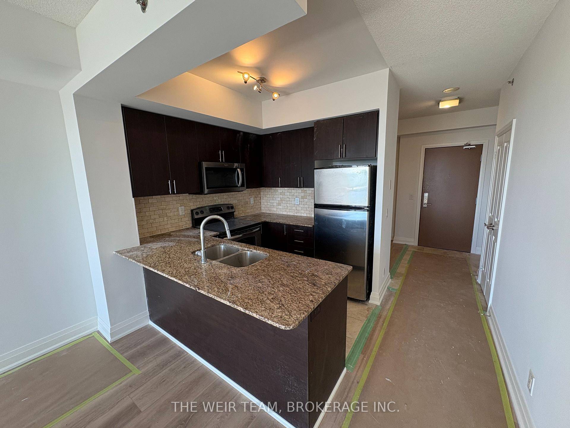 Freshly painted 1 1 bedroom condo with brand new flooring throughout.