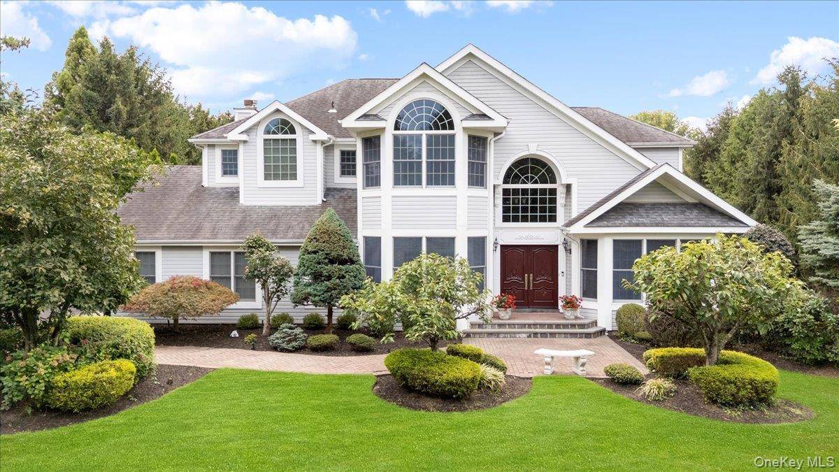 This majestic Post Modern Colonial masterpiece is located in the private, gated Dix Hills Farms community within the renowned Half Hollow Hills School District.