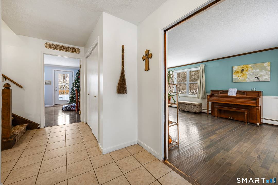 This four bedroom Colonial is tucked away at the end of a quiet cul de sac on a private lot with stone walls and nature fields.