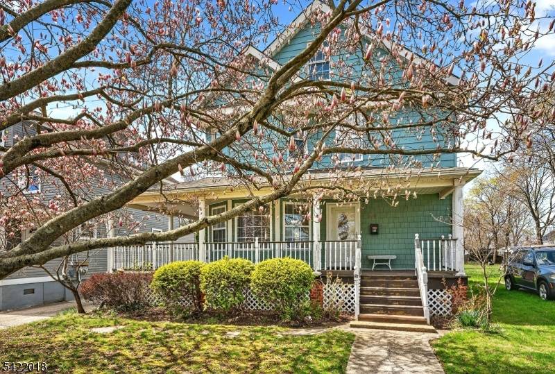 Location is everything This picture perfect colonial with charming wrap around rocking chair porch is ideally situated just.