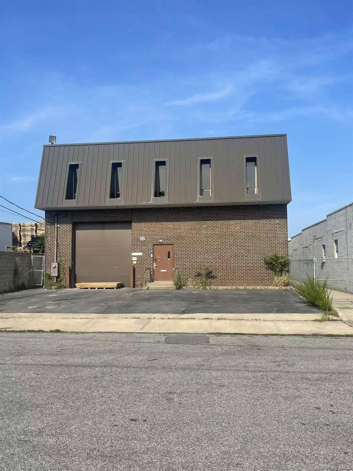 Spacious warehouse with modern office space located in the heart of Freeport s industrial district.