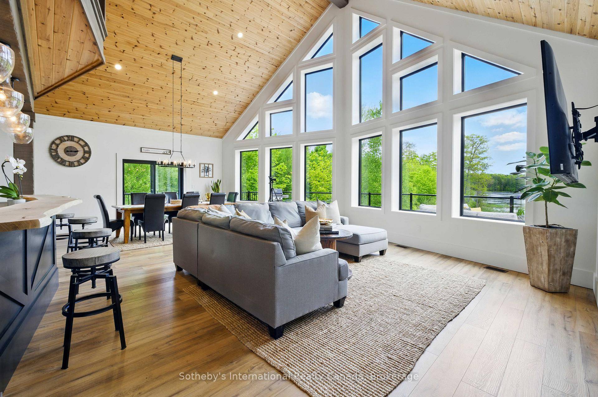 Nestled in Muskoka Lakes, this stunning property spans approximately 20 acres of lush, forested land, complete with an incredible lookout over a serene pond.