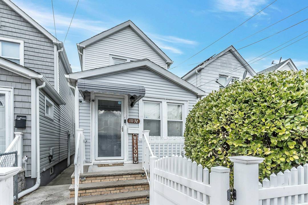 Welcome to this white picket fence, meticulously renovated gem of a home in the heart of Queens.